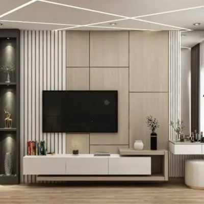 A modern TV unit design with a mix of wood, white panels, and vertical slats. The integrated shelving provides space for decor and books.