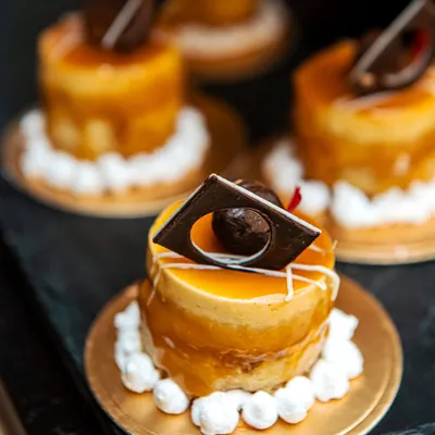 A beautiful mini caramel mousse cake, showcasing our pastry team's skill.