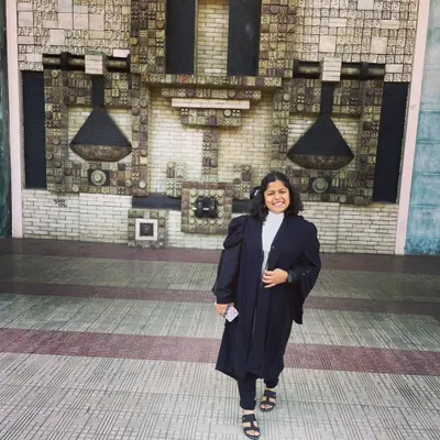 Standing outside the Delhi High Court, a place I deeply respect and admire. Wearing the advocate's gown here is a constant reminder of the profession I chose.