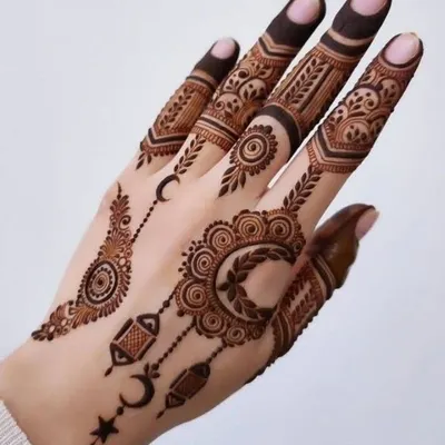 An elegant and modern Eid mehndi design. This style uses delicate crescents, stars, and lantern motifs, combined with fine jewelry-like patterns, to celebrate the spirit of Eid. It is light, beautiful, and perfect for the occasion.