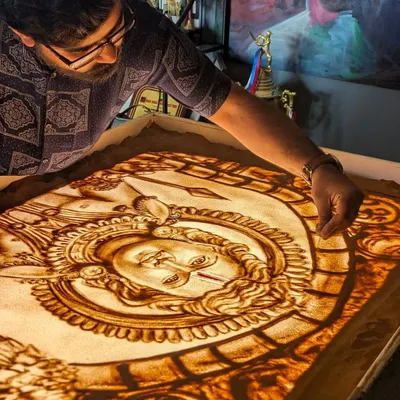 In my studio, deeply focused on creating a sand art piece of Lord Ram. Every detail is crafted with devotion. Jai Shree Ram.