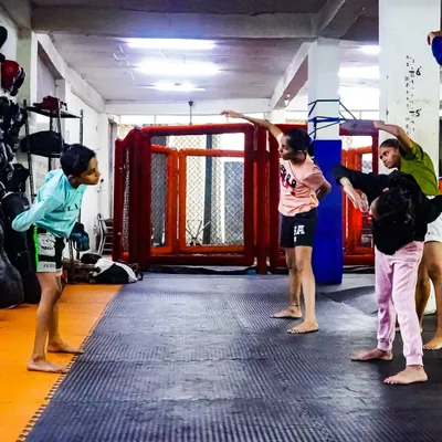 Our kids' program is not just about fighting. It's about learning discipline and coordination through structured drills. Here, young members practice their stances and movements together.