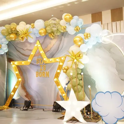 A stunning wide shot of our 'A Star Is Born' naming ceremony decor. The marquee star, crescent moon, and cloud cutouts against a marble-effect backdrop create a truly celestial and magical setting.
