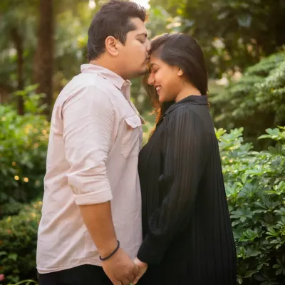 A classic and tender maternity portrait. The gentle kiss on the forehead beautifully captures the love and anticipation of the parents-to-be.