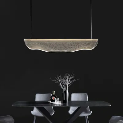 This 'Waves of Elegance' linear pendant is perfect over a modern dining table. Its fluid, ribbon-like design creates a stunning visual centerpiece.