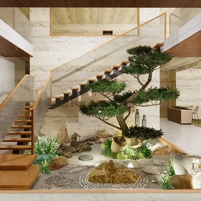 We transformed this unused space under a staircase into a breathtaking indoor Zen garden. The design features a mature bonsai tree, moss, natural stones, and a traditional Japanese lantern, creating a powerful statement of tranquility and balance within the home's architecture.