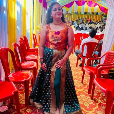 Here’s an Indo-western dress I created from an old saree. I used the rich green fabric for the skirt and the pallu's design for the embroidered bodice, creating a unique fusion outfit.