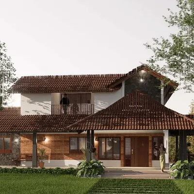 This view of a vernacular-style home highlights the use of a prominent tiled gable roof and stone-clad walls. The design provides deep, shaded verandas that serve as a transition between the interior and the garden, ideal for a tropical climate.