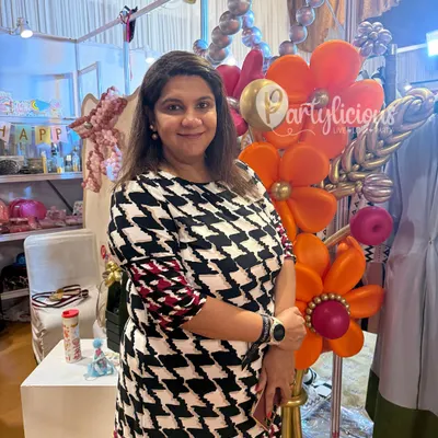 Partylicious at The Pink Post Inc. A photo of me at our exhibition booth, surrounded by the colors and creativity that define my brand. It was a joy to connect with so many of you.