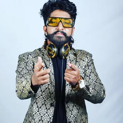 A professional portrait showing my style. I believe a DJ's presence and energy are just as important as the music they play.
