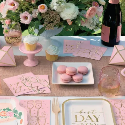 A beautifully set table is the heart of any celebration. For this event, I curated a complete tablescape with themed paper plates, napkins, macarons, and fresh flowers to create the "Best Day Ever."
