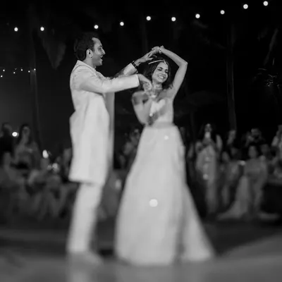 Sid and Sarah, the personification of elegance. A first dance is more than just steps; it's a conversation without words. We use light and shadow in our black and white photography to focus on the connection and the graceful flow of the moment.