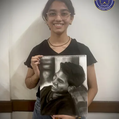 This stunningly realistic charcoal portrait, created by our student Shivani, shows the high level of skill our students can achieve. We focus on teaching techniques like shading and composition to bring our students' artistic visions to life.