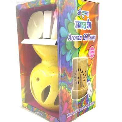 Our Ujjwal Deep Aroma Oil Lamp set is another great gift option. This package includes a yellow ceramic oil burner, a tealight candle, and aroma oil, all presented in a colorful and festive box.