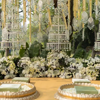 A Haldi ceremony that felt like a slow, sunlit poem. This elegant setup features delicate jasmine hangings and beds of white flowers, creating a serene and luxurious atmosphere for the ritual.