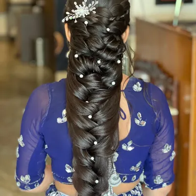 A perfect example of the Mermaid braid, adorned with pearls. This is a highly requested style that I teach in detail in my advanced workshops.