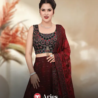 Aries, your bold and fiery energy calls for a statement look. This maroon lehenga with a detailed black blouse is the perfect match for your confident personality.