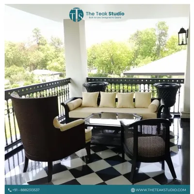 Embrace the monsoon with comfort and style. This elegant outdoor set, featuring a sofa and high-back chair on a checkered balcony, is perfect for enjoying the weather. We use durable materials and weather-resistant fabrics to ensure your furniture lasts.