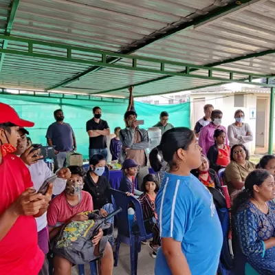 Spectators and players watch intently from the shaded viewing gallery during one of our academy events. This space provides a comfortable spot for parents and friends to support the players on court.