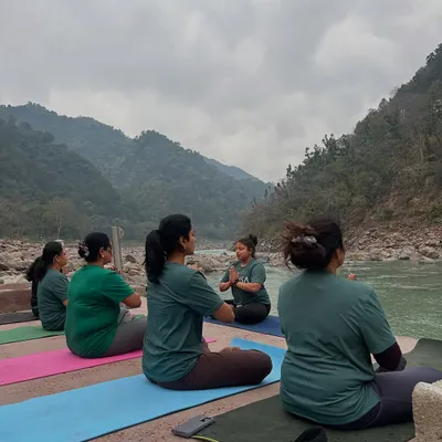 A moment of collective stillness as our group meditates together on the banks of the Ganga. Guided by an instructor, we find our focus amidst the natural beauty of Rishikesh, allowing the sounds of the river to deepen our practice.