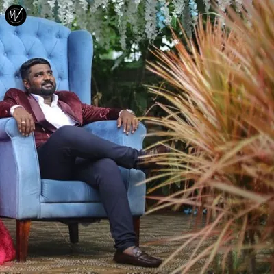 A closer look at our red velvet designer blazer for men. This piece adds a touch of luxury and color, making it an excellent choice for a groom at a reception or for a stylish pre-wedding shoot.