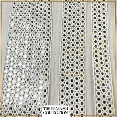 A set of elegant white mirror laces in straight-line patterns. The consistent arrangement of small mirrors provides a subtle shine, ideal for enhancing wedding outfits or traditional kurtas.
