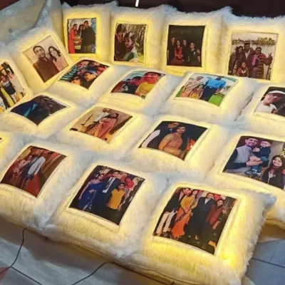 A large order of personalized LED photo cushions. These soft, furry cushions light up and can be printed with any photograph, making them a unique and heartfelt gift for personal or corporate events.