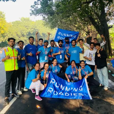 The whole Running Roadies crew together after supporting the Delhi Half Marathon. We travel across cities to support major running events, bringing our unique Bengaluru energy everywhere we go.