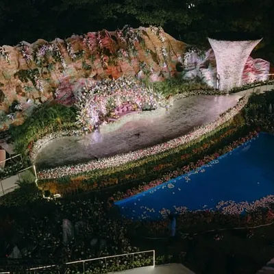 An aerial view of the reception stage we built, complete with a mountain backdrop, a massive fountain, and a custom water body. This is a testament to our architectural approach to event design.