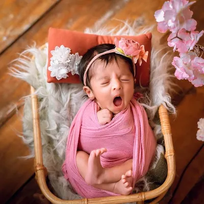 A perfectly timed yawn. These are the candid, unscripted moments that bring so much character to a newborn session.