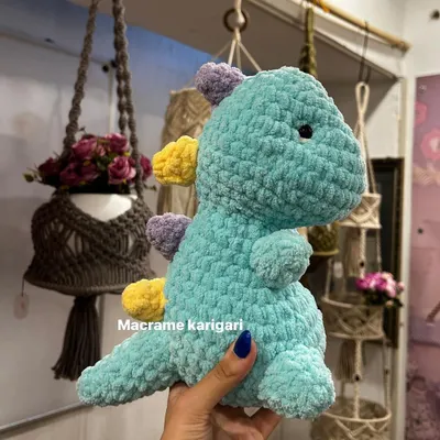 Meet our adorable crochet dinosaur! Made with super soft, chunky yarn in a cool mint color, this plush toy is perfect for cuddles and imaginative play.
