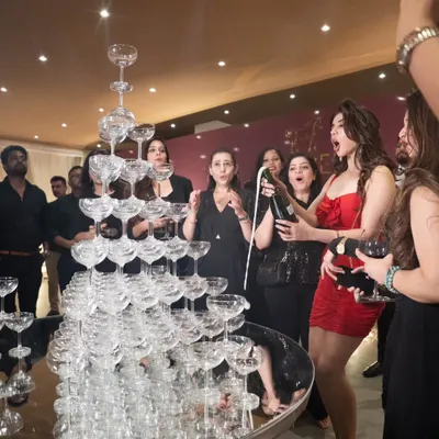The highlight of a 15th-anniversary celebration for Fennel Living. A grand champagne tower creates a moment of collective celebration and excitement, perfectly capturing the spirit of a major milestone.