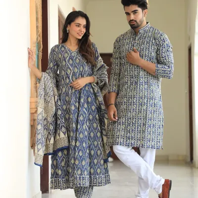 A beautiful hand-block printed couple combo. The woman's Anarkali set and the man's kurta both feature a matching indigo paisley design on pure cotton, creating a harmonious and elegant look.