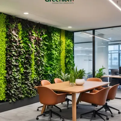 This office meeting room features a floor-to-ceiling living wall, creating a calm and inspiring atmosphere. Biophilic design elements like this have been shown to improve focus and creativity in a work setting.