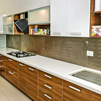 This kitchen showcases a practical and stylish modular design with a mix of wood-finish and white cabinets. I included specialized storage solutions like a pull-down spice rack to ensure every inch of space is used effectively.