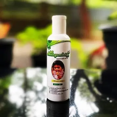 This is my special Child Care Oil, made for the delicate skin of children. It helps with skin issues like 'karappan' (eczema) and dandruff. I make this in very small batches with herbs like thechi, chembarathi, and krishnathulasi.