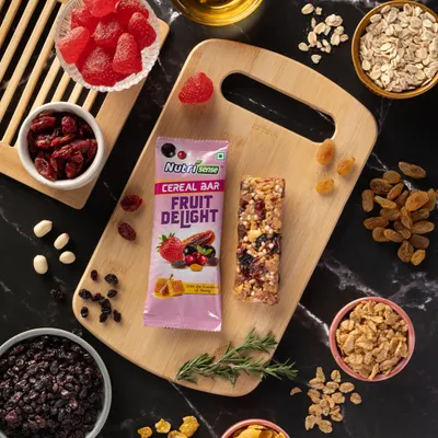 For this cereal bar, I deconstructed the product to showcase its wholesome ingredients. A top-down flat lay composition like this is effective for highlighting the natural components and telling a story of health and flavor.