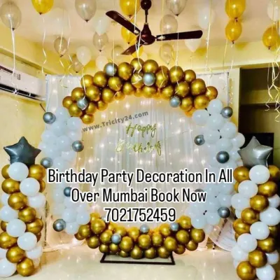 A beautiful gold and white balloon ring setup perfect for a living room. I can bring all the elements, including the shimmer curtain and balloon pillars, to create a festive corner in your home.