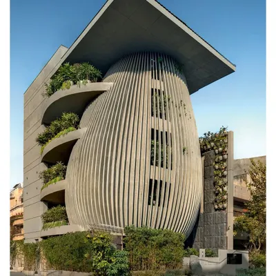 The Atrey & Associates design studio, featured in Architecture+Design. The building's form is inspired by a tree, with a central trunk and branching, fractal-like configurations that create a dynamic and organic structure.