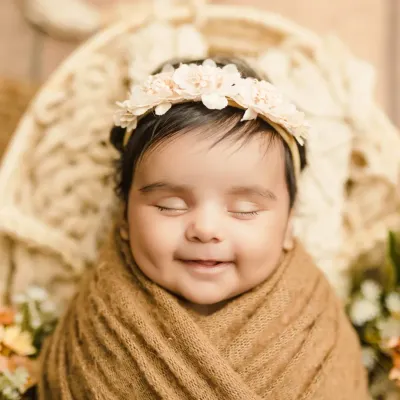 That dimpled smile! This is the kind of precious, happy moment we love to capture. A simple, close-up portrait lets your baby's personality shine.