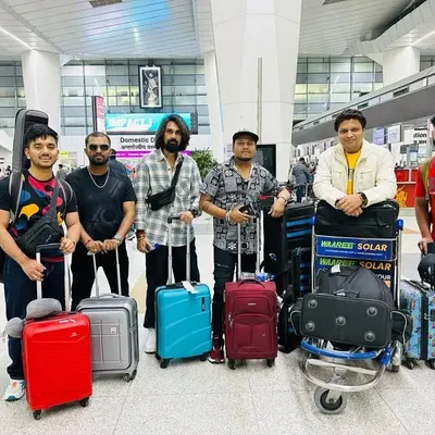 The journey begins. The full band at the airport, packed and ready to head to Colombo for an international show. We handle all our logistics for a hassle-free experience.