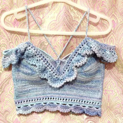 A custom-made 'Masakali' bralette top in a beautiful blue-purple variegated yarn. It features delicate lace details, off-the-shoulder ruffles, and adjustable straps for a perfect, comfortable fit.