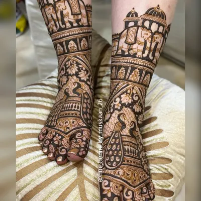 A classic and rich bridal feet design. This full coverage henna features majestic peacocks and royal elephants, with detailed patterns covering the entire foot for a stunning look.