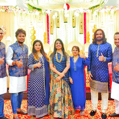 A group photo with my amazing team after a successful musical wedding phere. Their talent and dedication are the backbone of my events.