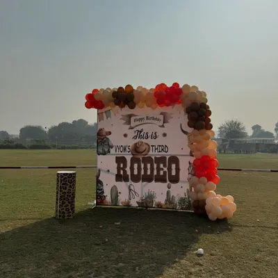 A custom "Rodeo" themed birthday backdrop set up on the lawn. I can accommodate various party themes to make your child's day extra special.