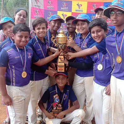 The U-12 Purple Team celebrating their PTPL 2024 championship win. Their excitement is contagious as they all get their hands on the coveted trophy.