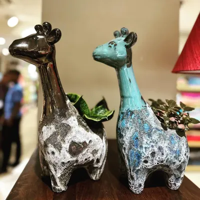 Come check out my new animal planters collection. These giraffe pots feature a unique mix of glazing and a rough Atlantis finish, making them a fun and artistic home for your favorite small plants.