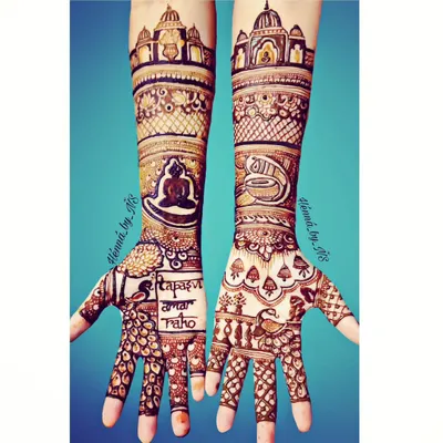 This intricate design was for a Siddhitap Tapasvi. One hand features a meditating Tirthankara figure, while the other shows a sacred Shankha, or conch shell, both surrounded by detailed traditional patterns.