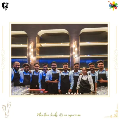Our powerhouse team of bartenders and mixologists assembled behind the bar. Dressed in professional aprons, this group photo represents the skill and teamwork we bring to every large-scale event.