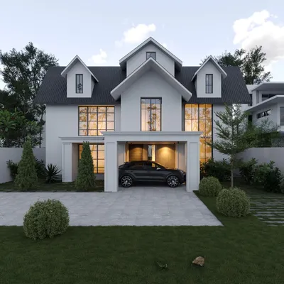 A new project in Palakad with a classic colonial-inspired design. This home features a symmetrical white facade, large windows, and distinctive dormer windows on the upper floor.